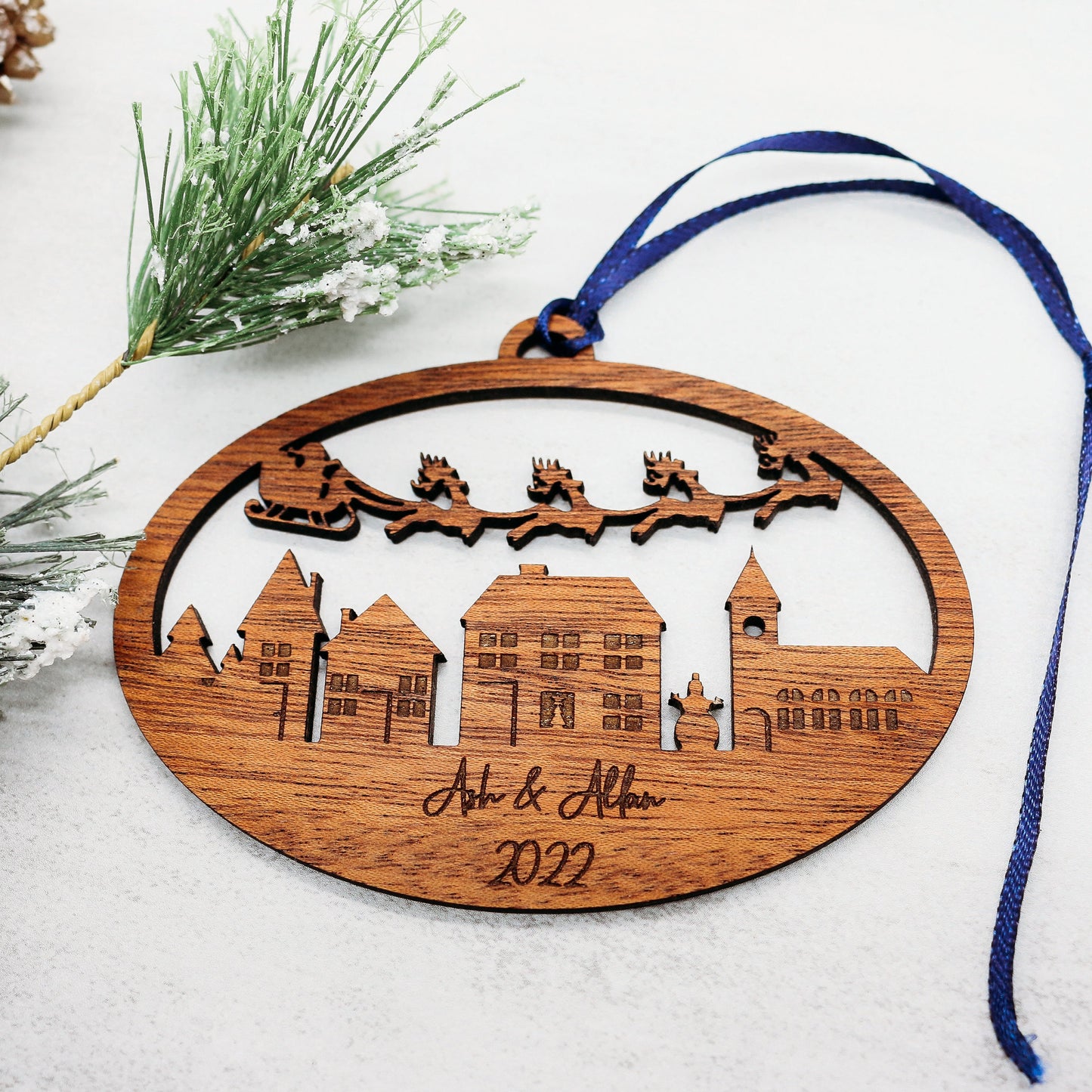 Engraved Wooden Christmas Ornament: Santa's Sleigh Flying Over Charming Village Personalized